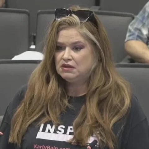 Amber Wood speaking at a county board meeting.